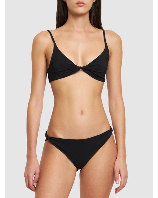 Top de bikini triangular Totême  de color Black