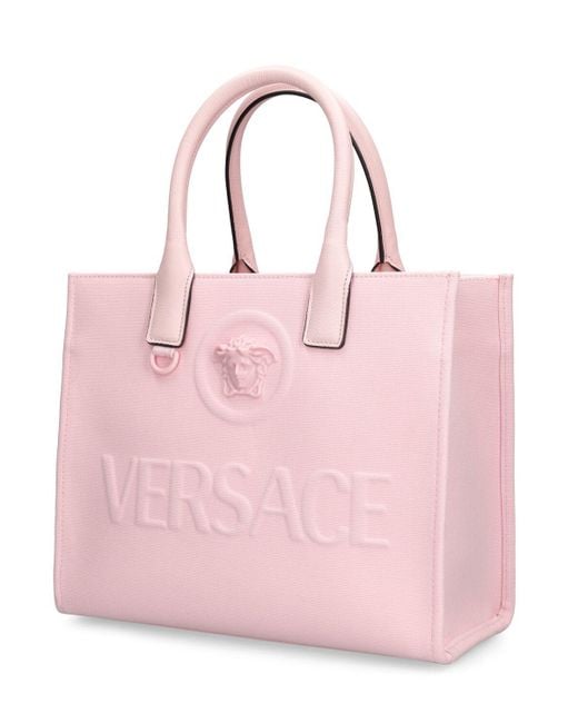 Petit sac cabas en toile medusa Versace en coloris Pink