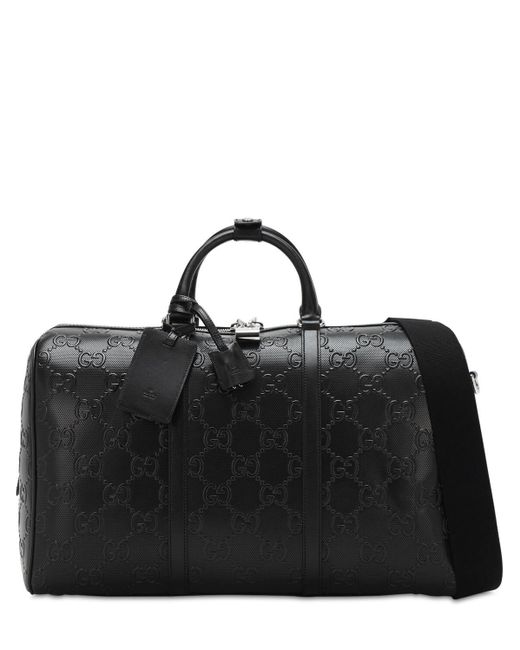 Gucci Reisetasche aus geprägtem GG Leder in Black für Herren