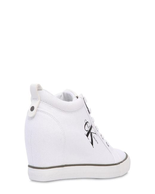 Calvin Klein 70mm Ritzy Cotton Canvas Wedge Sneakers in White | Lyst  Australia
