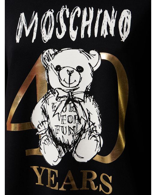Felpa in jersey di cotone con logo stampato di Moschino in Black