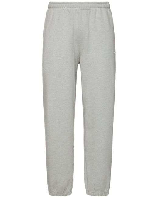 Homme Pantalon Solo Swoosh Nike pour homme en coloris Gray