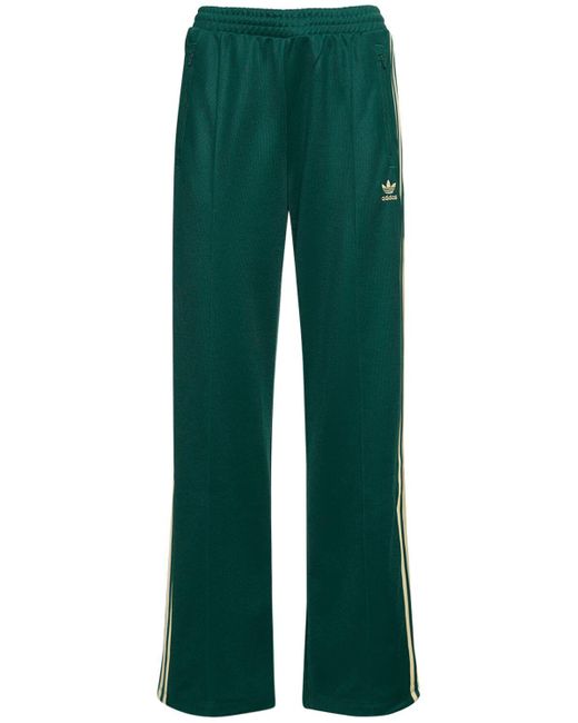 Pantaloni beckenbauer in techno di Adidas Originals in Green