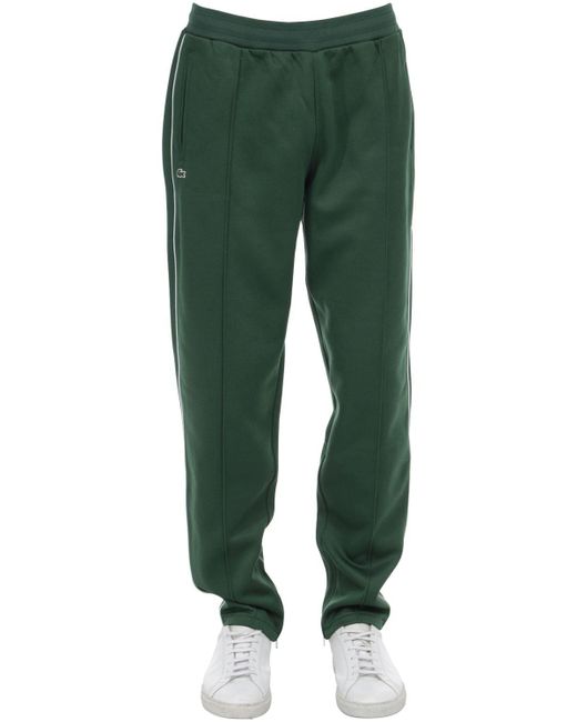 green lacoste guppy pants