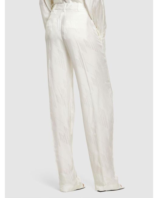 Pantalon ample en satin jacquard à logo jagger The Attico en coloris White