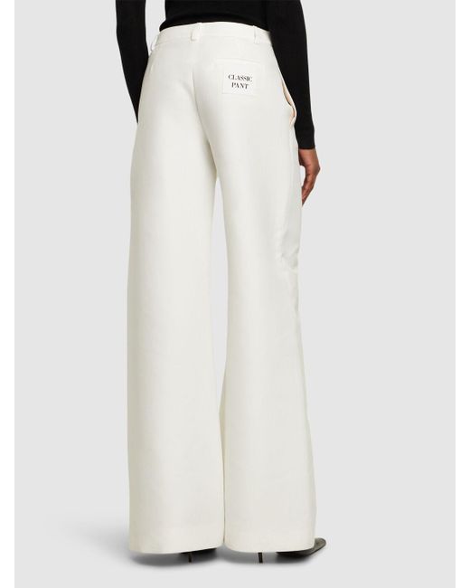 Pantalones anchos de algodón duchesse Moschino de color White