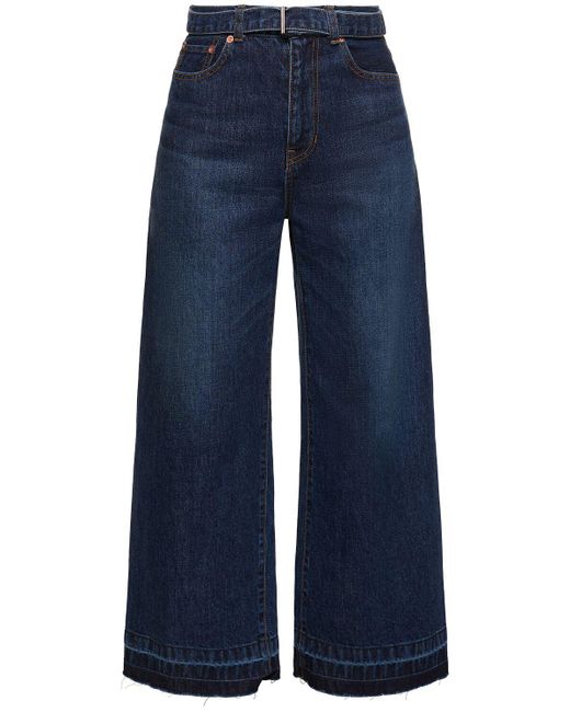 Jeans larghi vita media in denim / cintura di Sacai in Blue