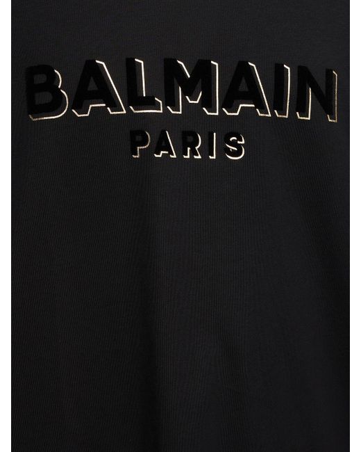 T-shirt con logo floccato di Balmain in Black da Uomo