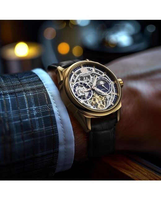 Stuhrling Gray Vanguard 1019.04 Legacy Collection Dual Time Automatic Skeleton Watch 42mm Gold Tone Black Dial Leather Strap for men
