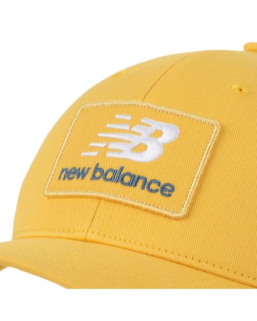 New Balance Yellow Stacked Patch Logo Clementine Trucker Hat for men