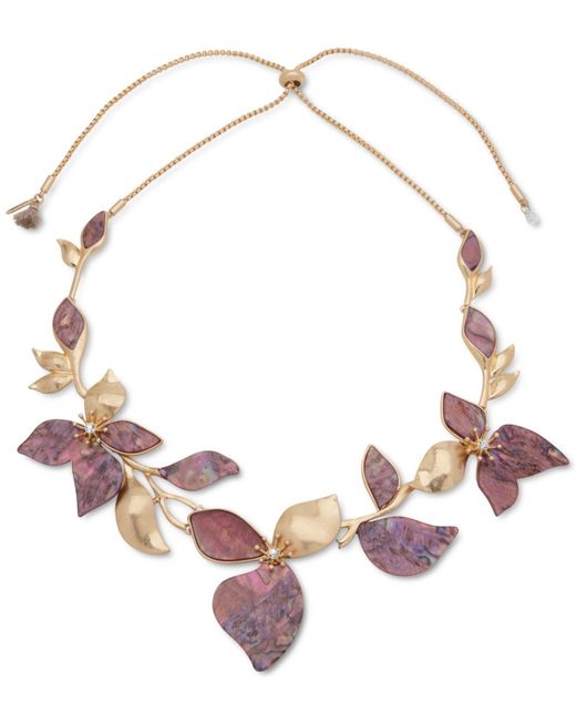 in the garden with a burgundy dress and bronze jewelry - MEGAN AUMAN