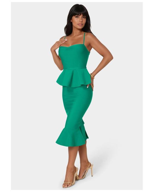 Bebe Peplum Bandage Midi Dress in Green | Lyst