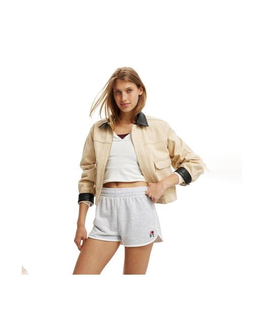 Cotton On White Dolphin Hem Licensed Micro Mini Short