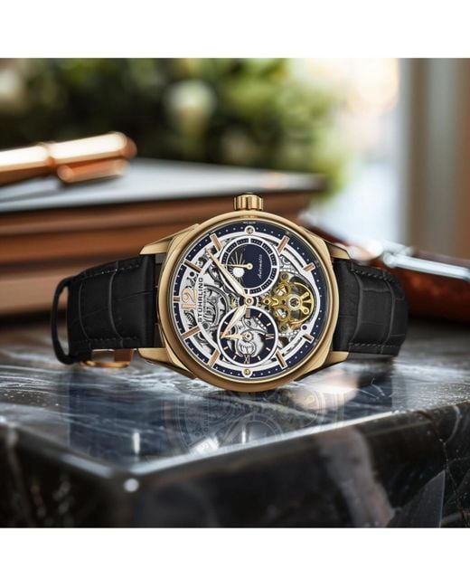 Stuhrling Gray Vanguard 1019.04 Legacy Collection Dual Time Automatic Skeleton Watch 42mm Gold Tone Black Dial Leather Strap for men