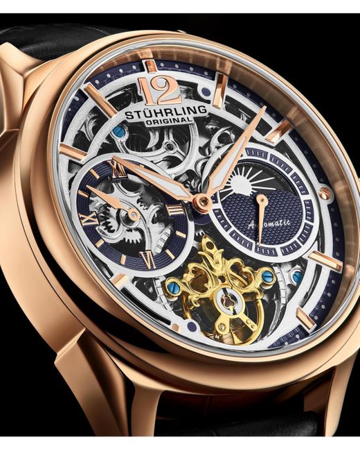 Stuhrling Gray Vanguard 1019.04 Legacy Collection Dual Time Automatic Skeleton Watch 42mm Gold Tone Black Dial Leather Strap for men