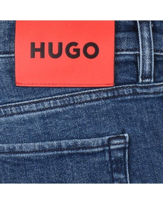 HUGO Blue 634 Tapered Fit Mid Wash Jeans for men