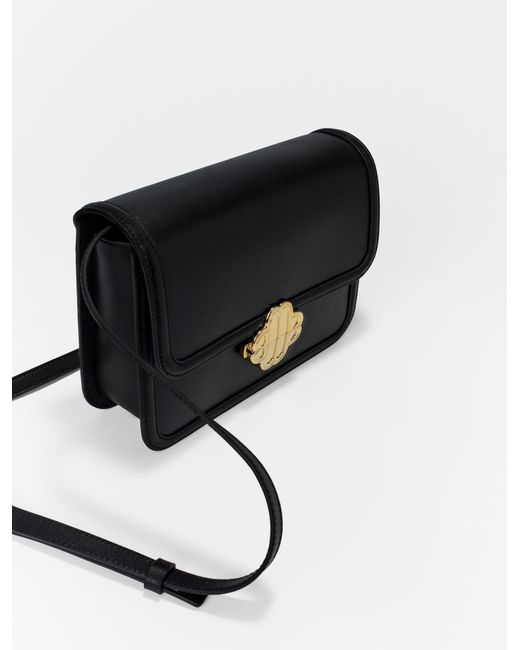 Maje Leather Bag With Clover Clasp in Black | Lyst