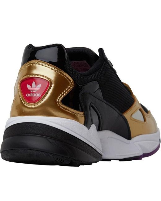 black and gold adidas trainers