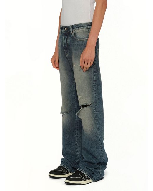 Amiri Blue Slashed Bootcut Jean for men