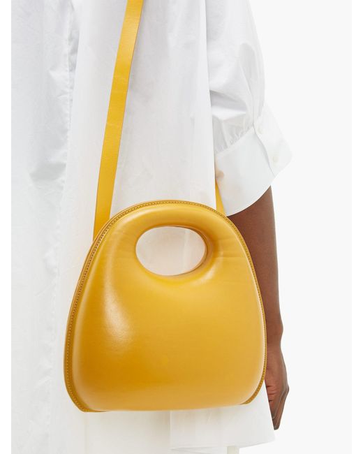 Lemaire Egg Smooth leather Bag in Yellow Lyst