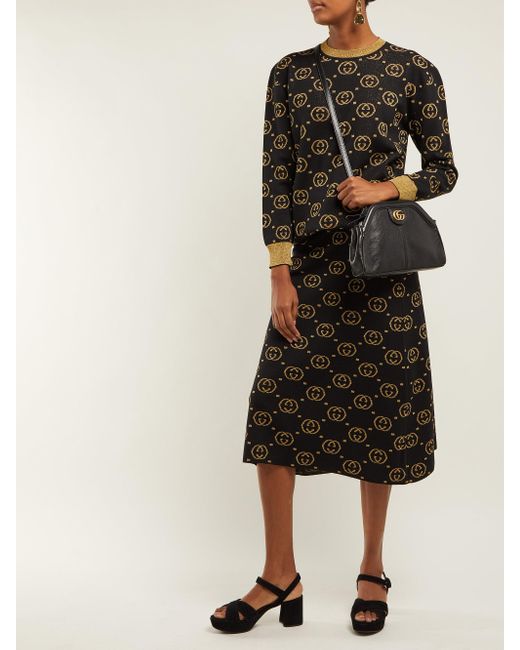 black and gold gucci sweater