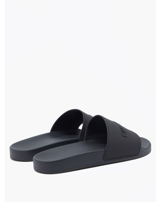 Balenciaga ゴム プール ロゴ ラバーサンダル カラー ブラック メンズ Lyst