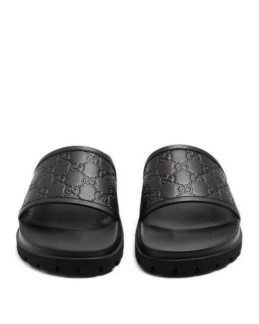 Gucci Gg Embossed Leather Pool Slides in Black for Men Lyst