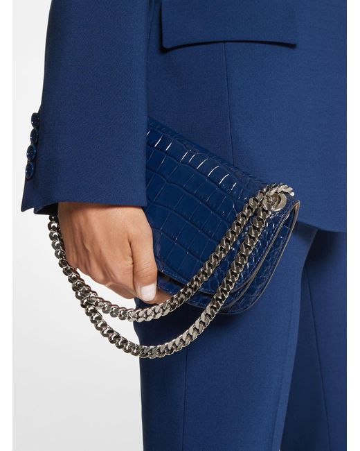 Bolso tipo sobre Christie mini de piel con motivo de cocodrilo en relieve Michael Kors de color Blue