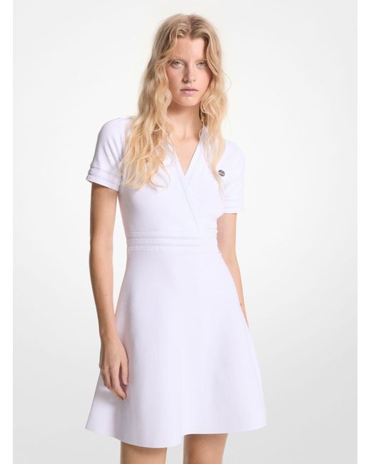 Mini-robe évasée en tricot extensible Michael Kors en coloris White