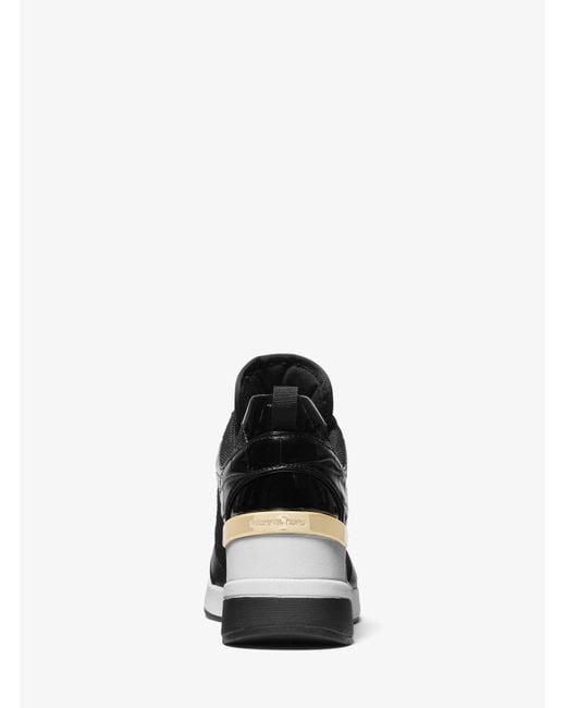Sneaker Georgie in pelle stampa coccodrillo e nylon di Michael Kors in Black