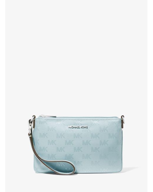 Pochette da polso convertibile Jet Set Travel piccola in nylon con logo di Michael Kors in Blue