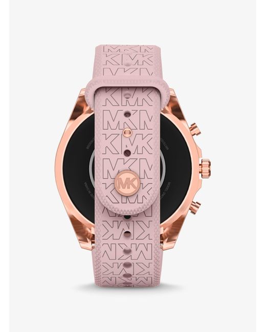 Montre connectée Gen 6 Bradshaw ton or rose avec bracelet en silicone à logo Michael Kors en coloris Pink