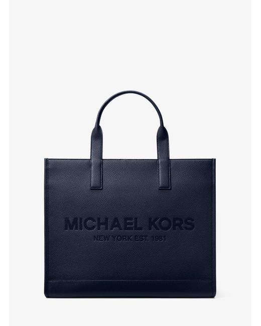 Michael Kors Cooper Logo Embossed Faux Pebbled Leather Tote Bag in Blue
