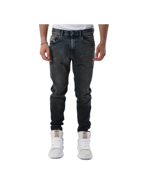Slim fit destroyer jeans di DIESEL in Blue da Uomo