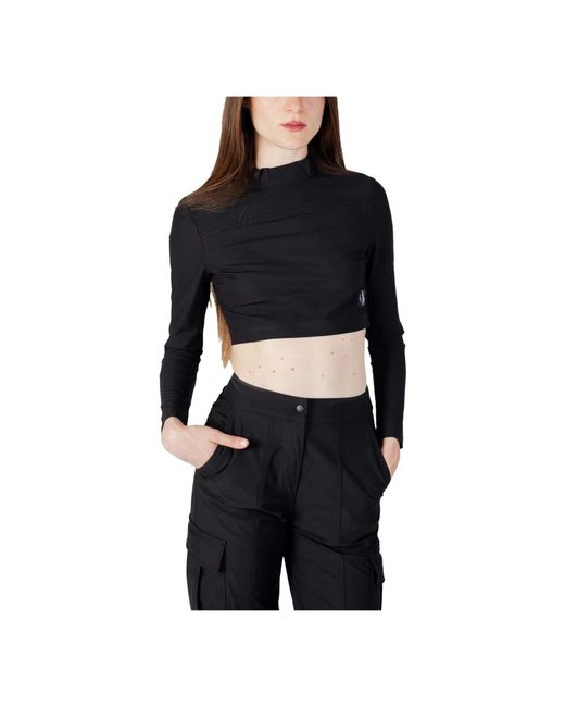 Magliette a maniche lunghe nera da donna di Calvin Klein in Black