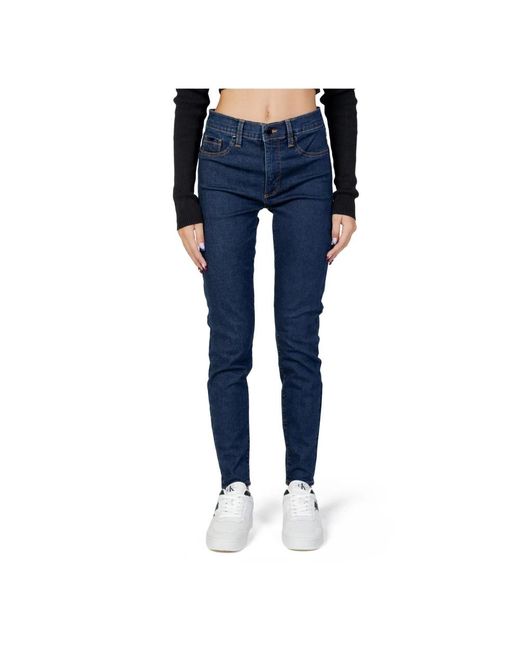 Jeans blu con chiusura a zip e bottone di Calvin Klein in Blue
