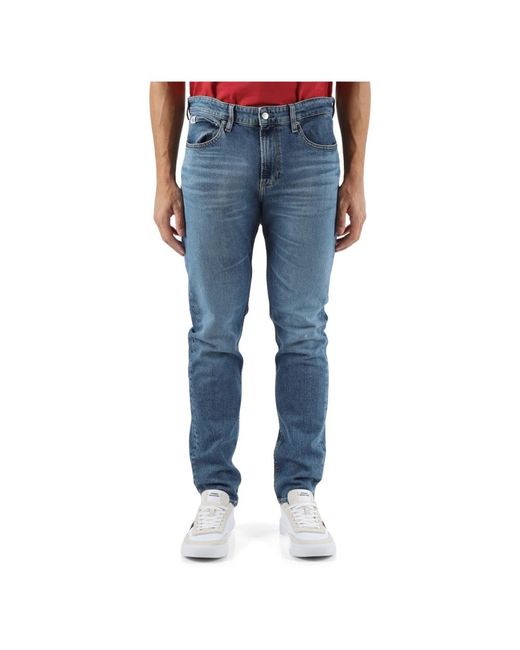 Jeans slim taper cinque tasche di Calvin Klein in Blue da Uomo