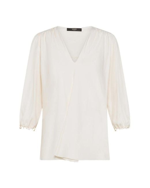 Seventy White Blouses