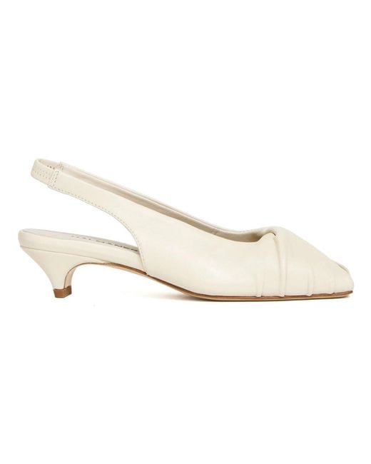 Halmanera White Pumps