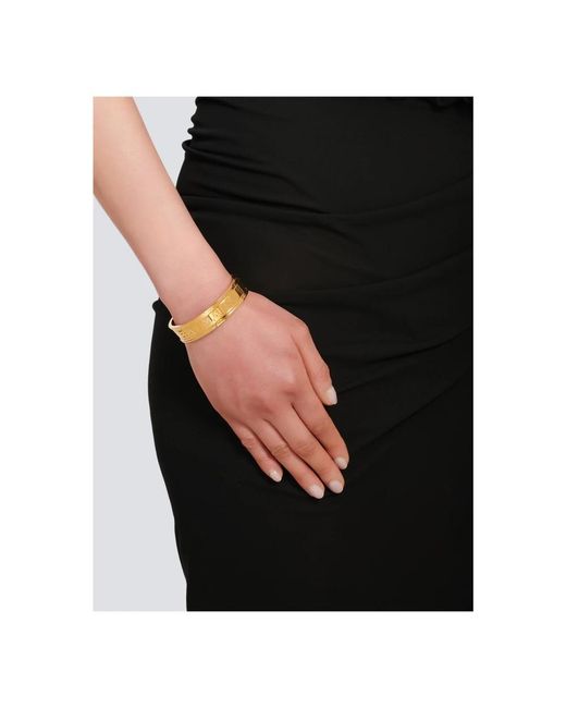 Balmain Metallic Goldfarbener Armreif aus Messing mit -Logo