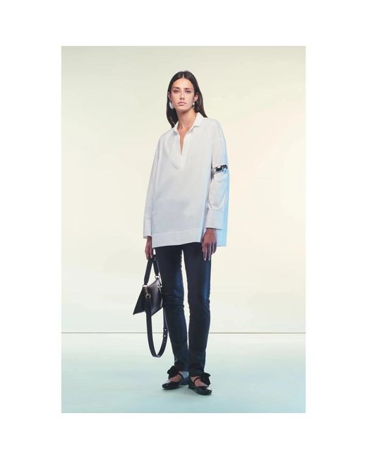 Liviana Conti White Tunics