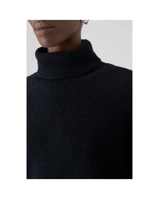 Closed Black Turtlenecks