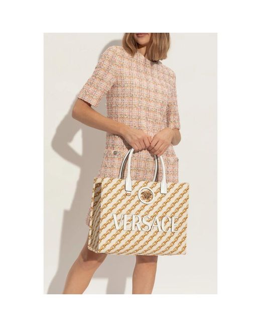 Handbags Versace de color Metallic