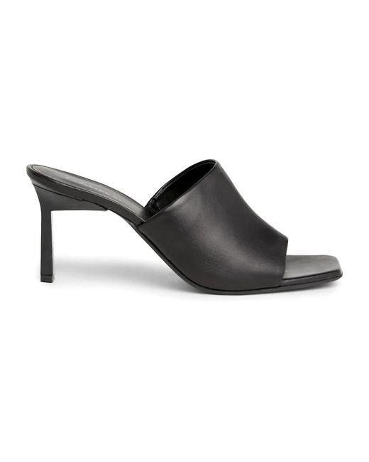 Zapatos sabot de cuero Calvin Klein de color Black