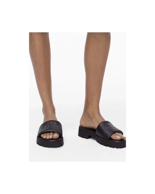 Marc Jacobs Blue Schwarze Slip-On Debossed Logo Schuhe