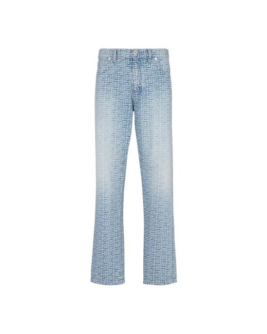 Jeans in denim jacquard monogramma di Balmain in Blue da Uomo