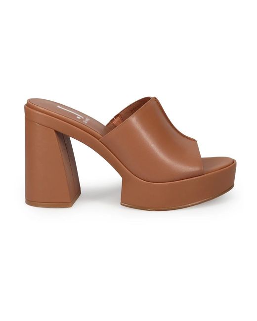 Heeled Mules di Jeannot in Brown