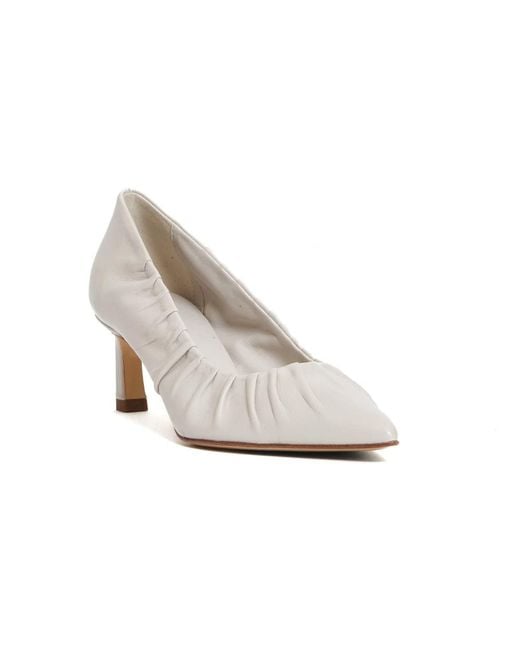 Halmanera White Pumps