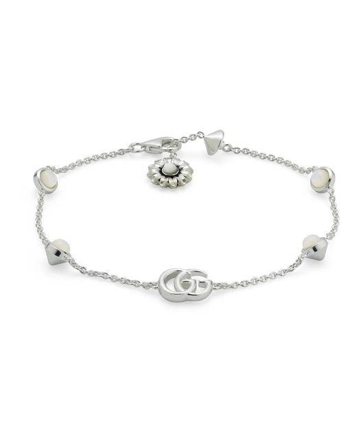 Pulsera de plata de ley y nácar con doble g y detalles de flores Gucci de color Metallic