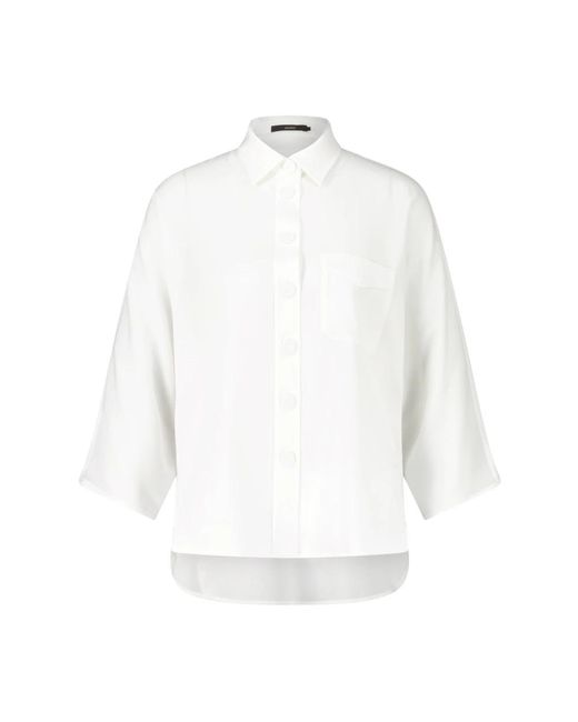 Ampia camicia da donna con bottoni in tessuto di Windsor. in White